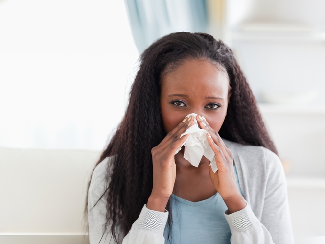 Woman sneezing