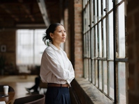 Businesswoman looking out window