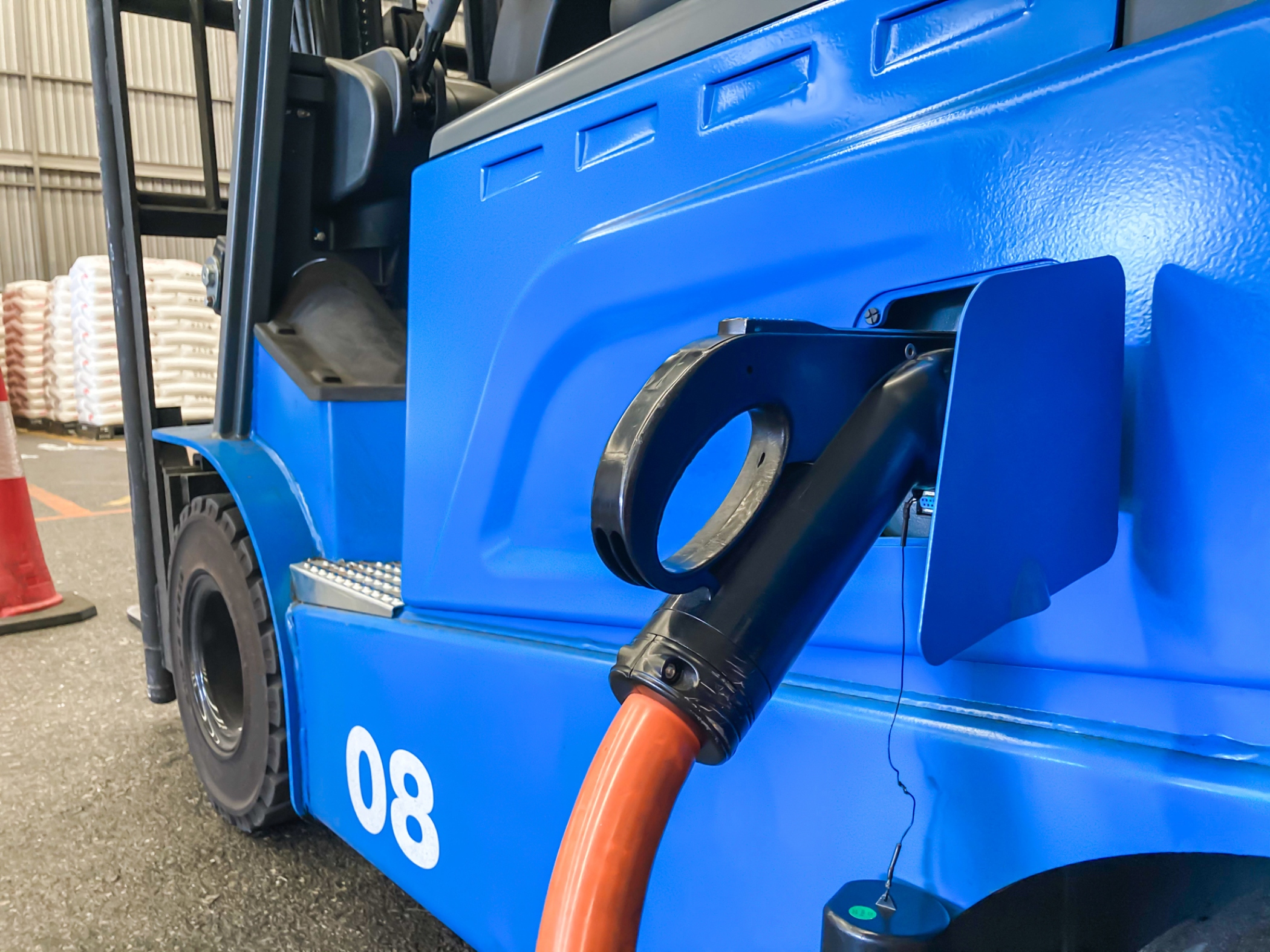 Electric forklift charging in warehouse