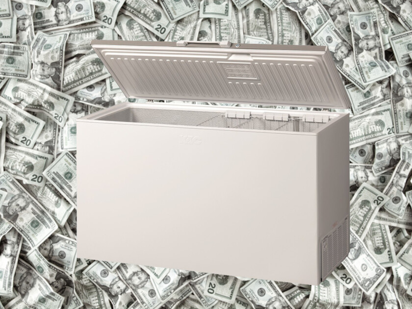 Chest freezer with background of $20 bills