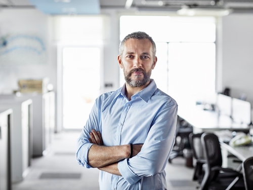 Businessman standing in empty office