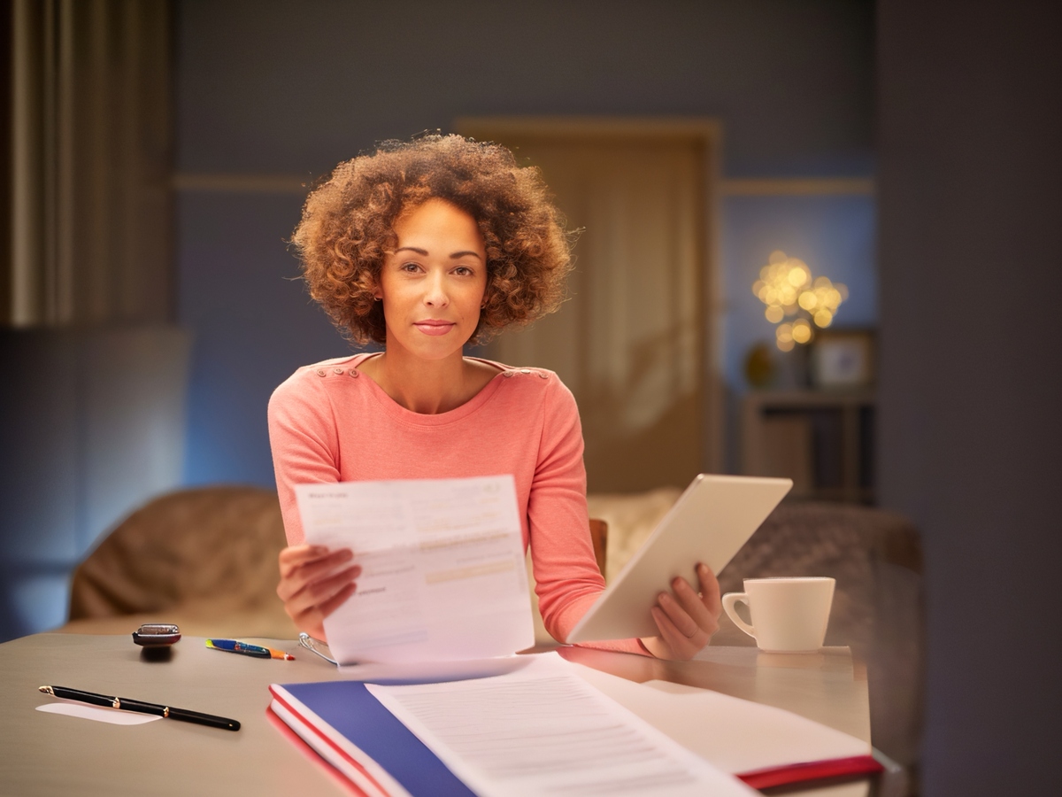 Woman holding bill