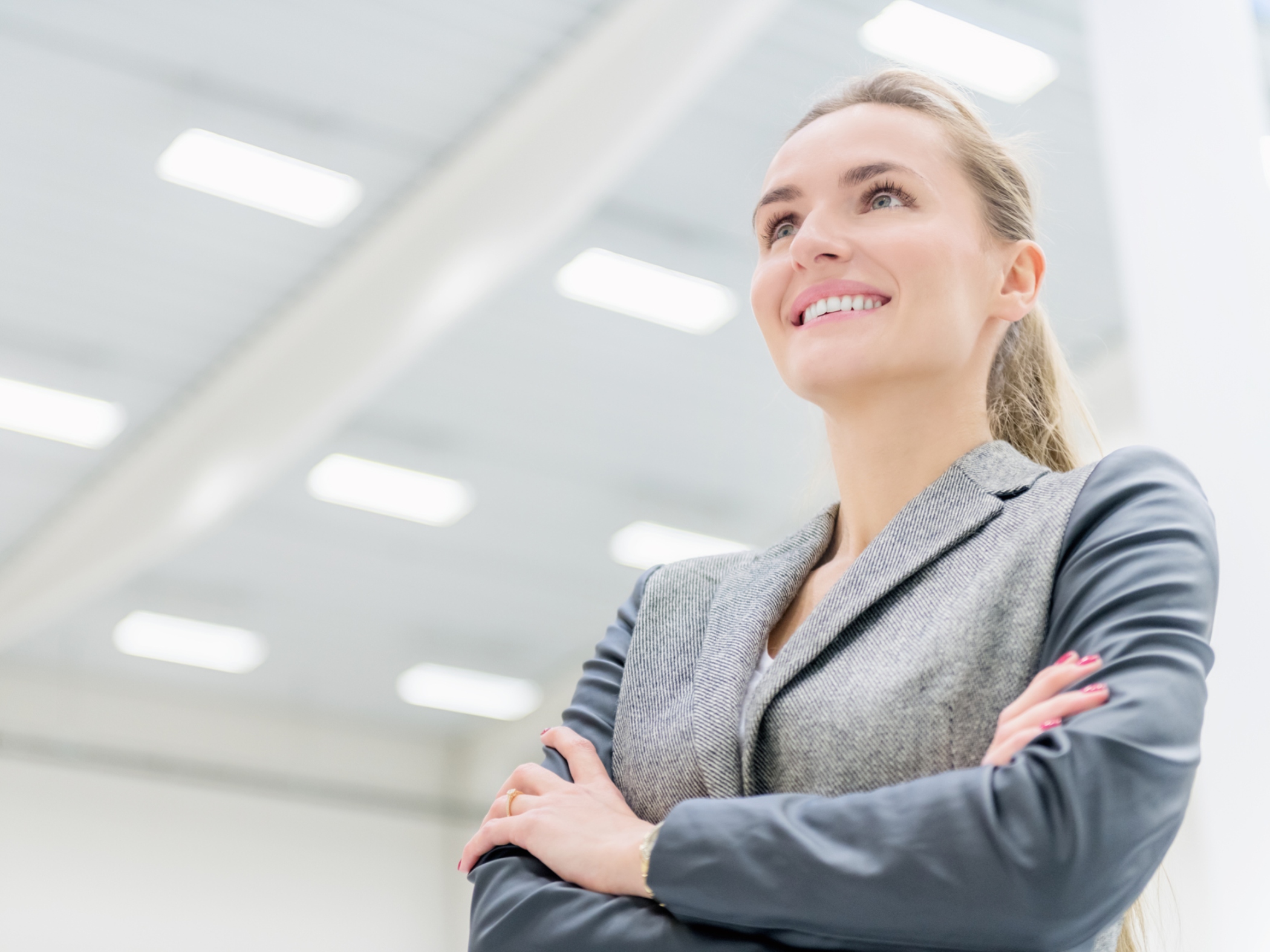 Smiling business woman looking at lights