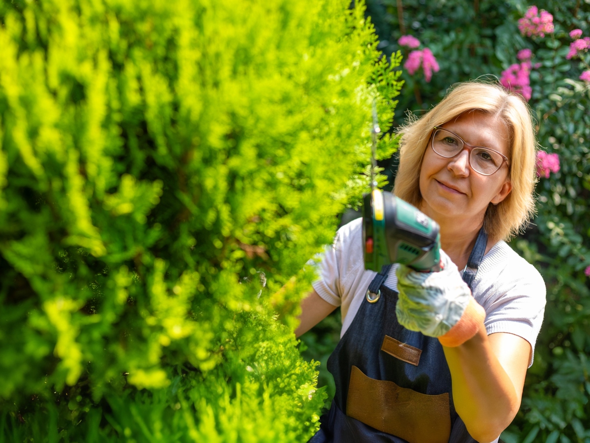 Woman using trimmer