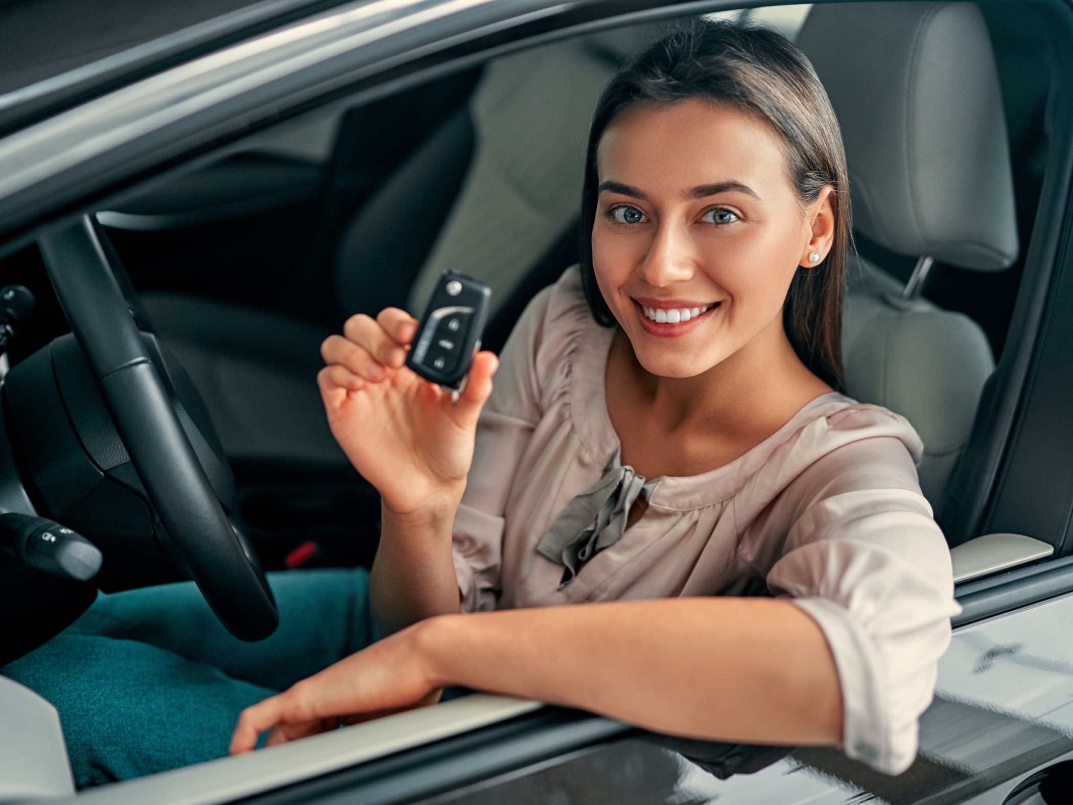 Woman holding a new car key