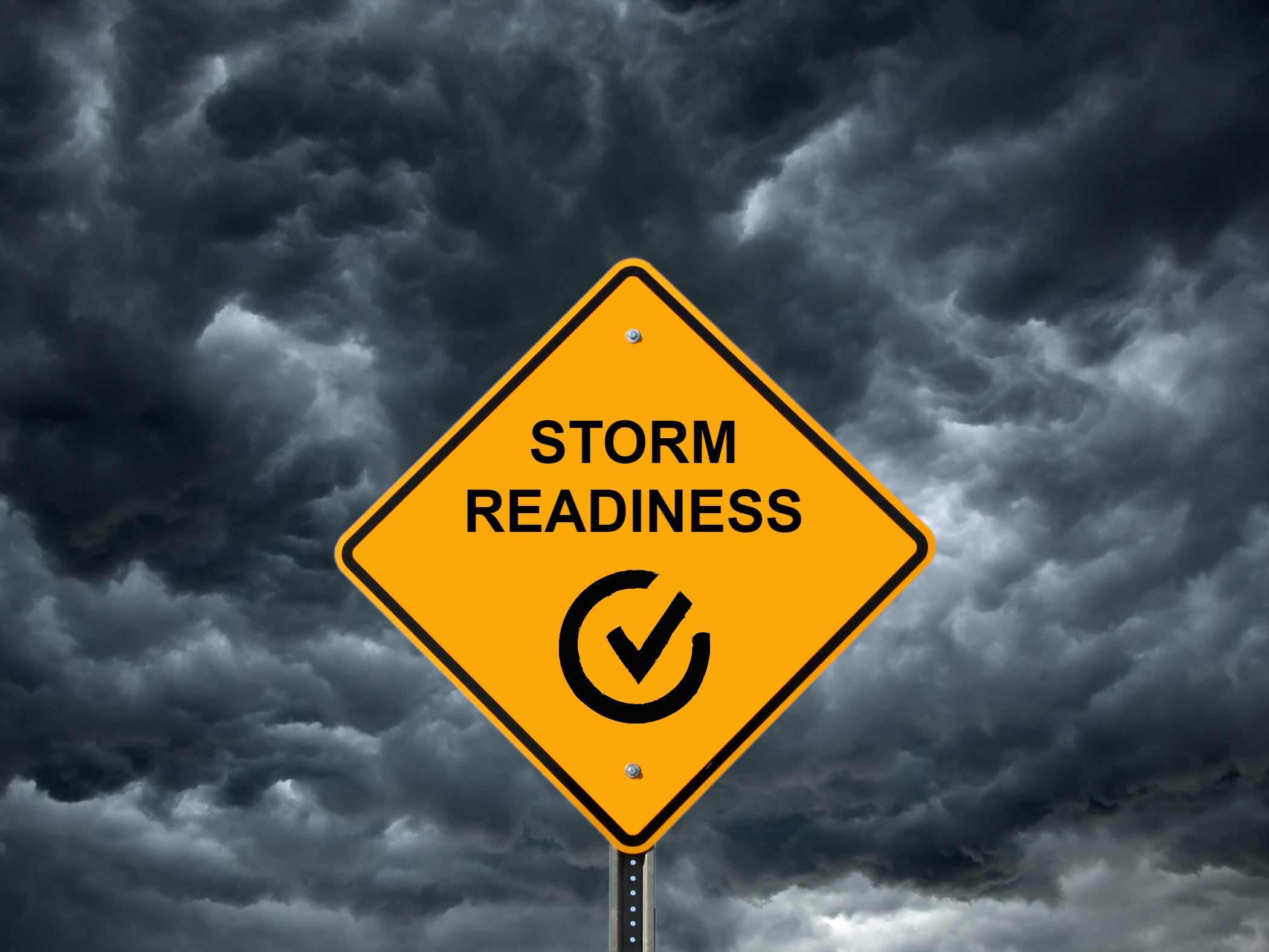 Road sign with storm clouds