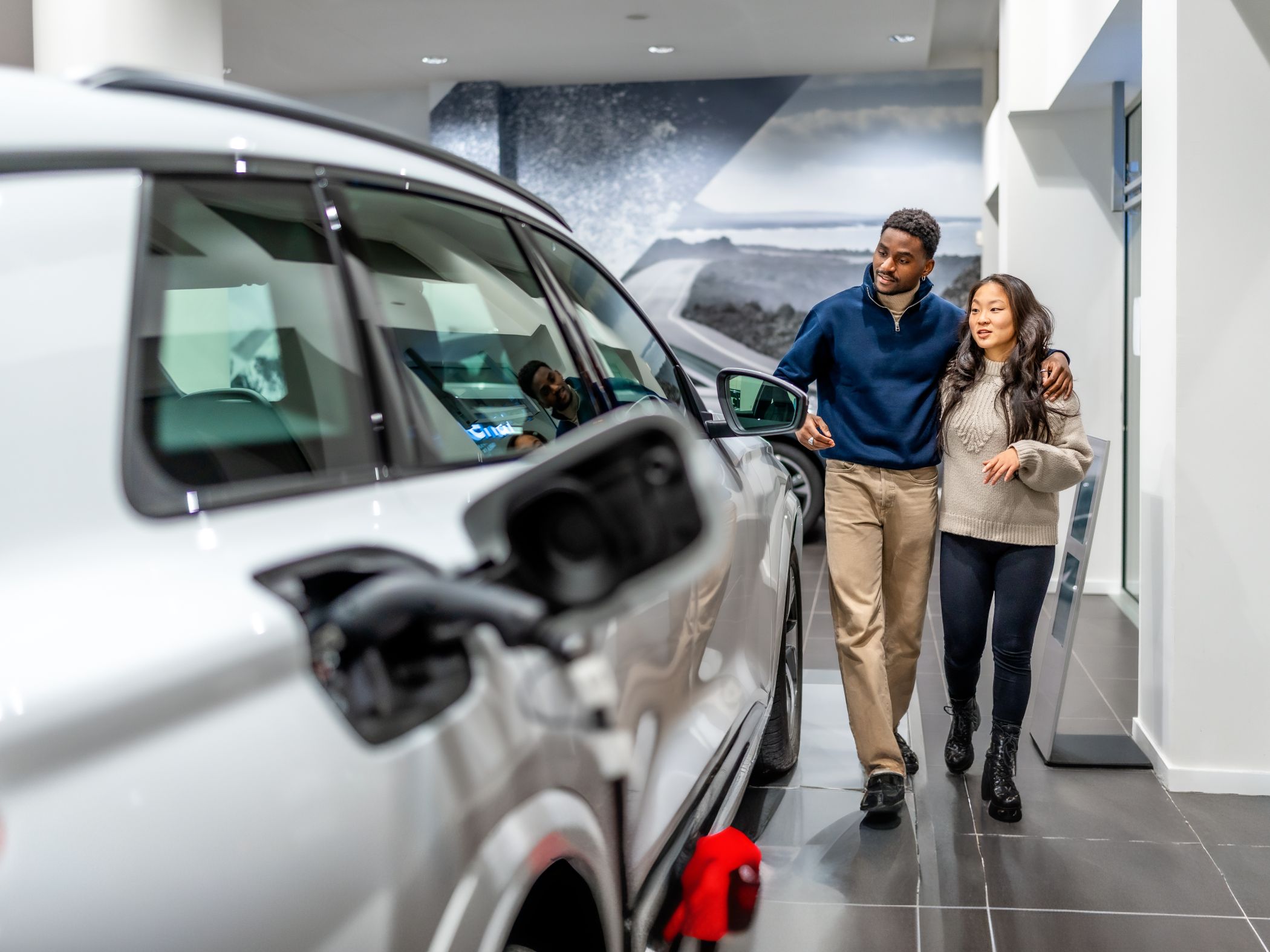 Looking at car in dealership