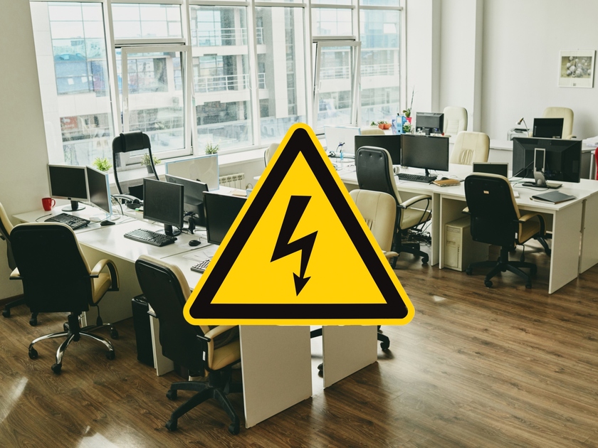 Empty office with electrical hazard warning sign