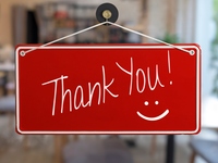 Sign in store window saying "Thank you!"
