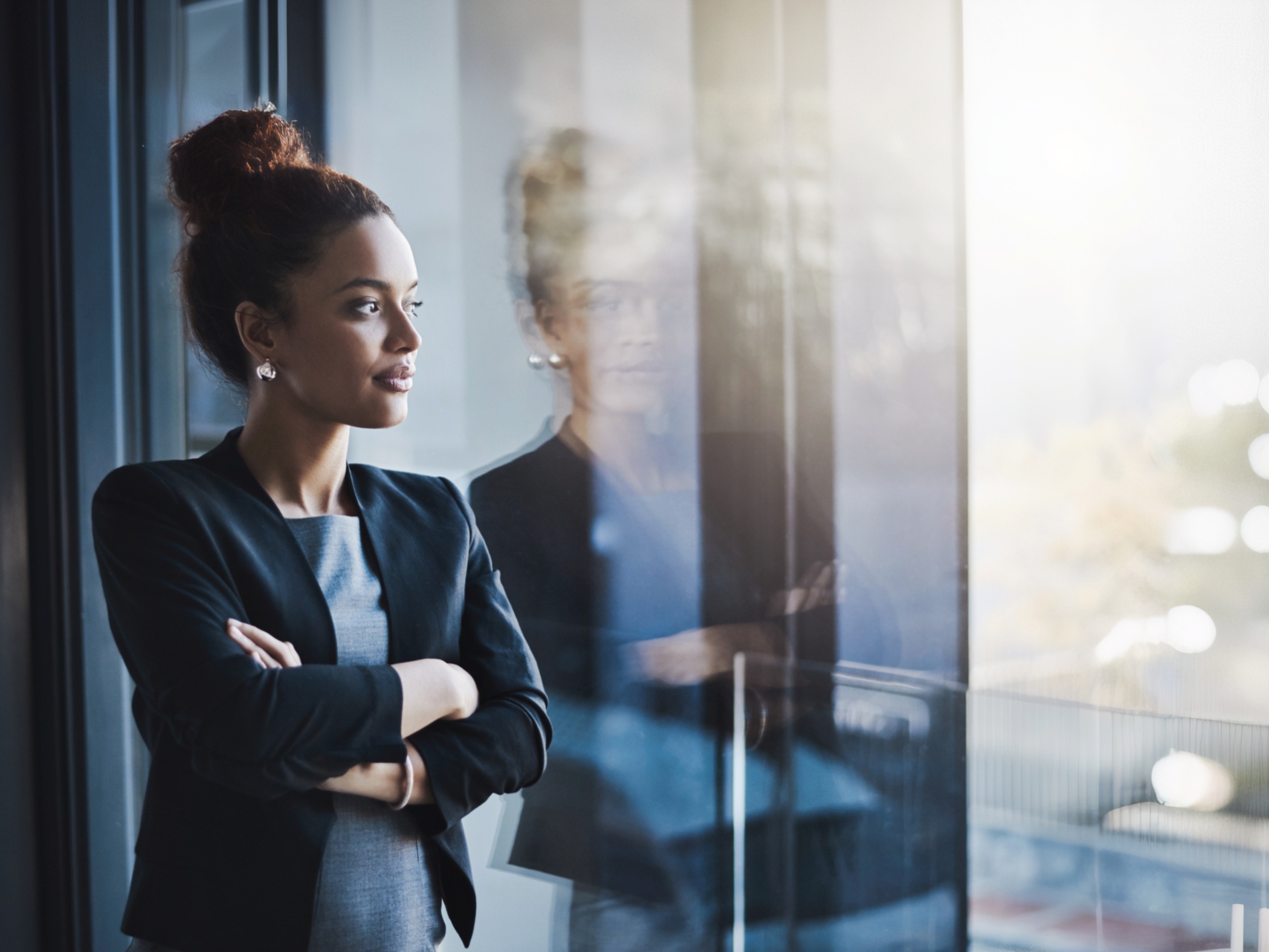 Businesswoman looking out window