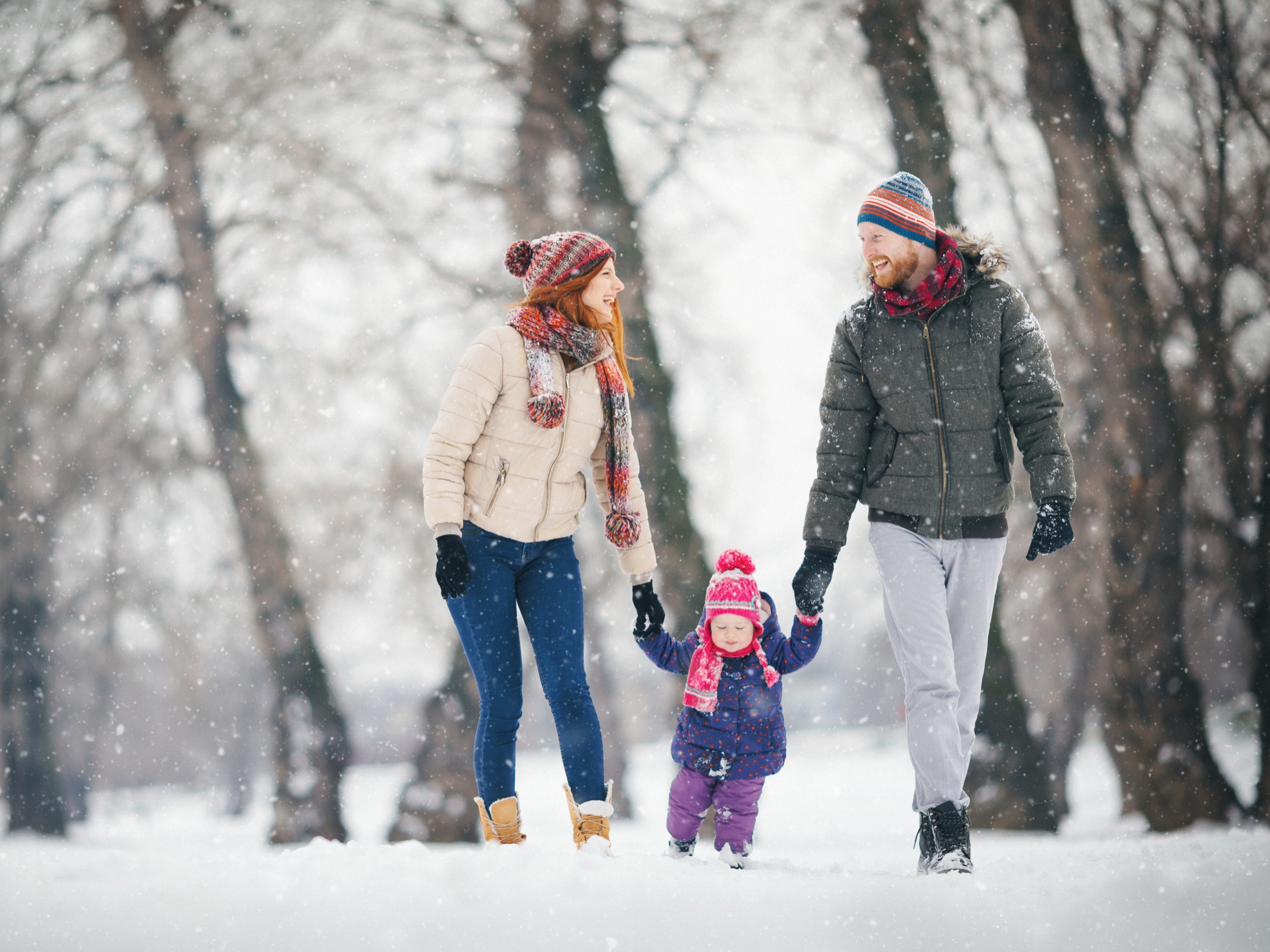 Family walking outdoors in snow