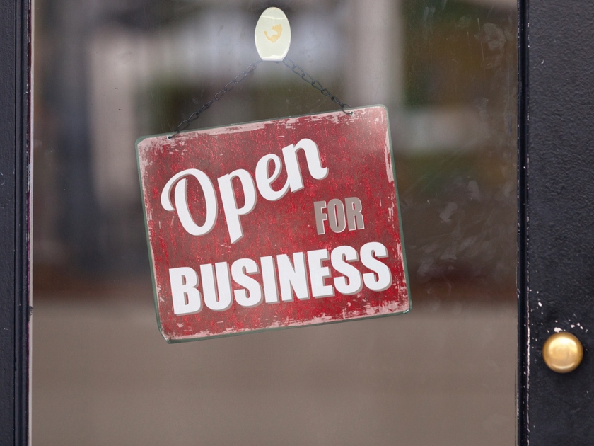 Open for Business sign in doorway