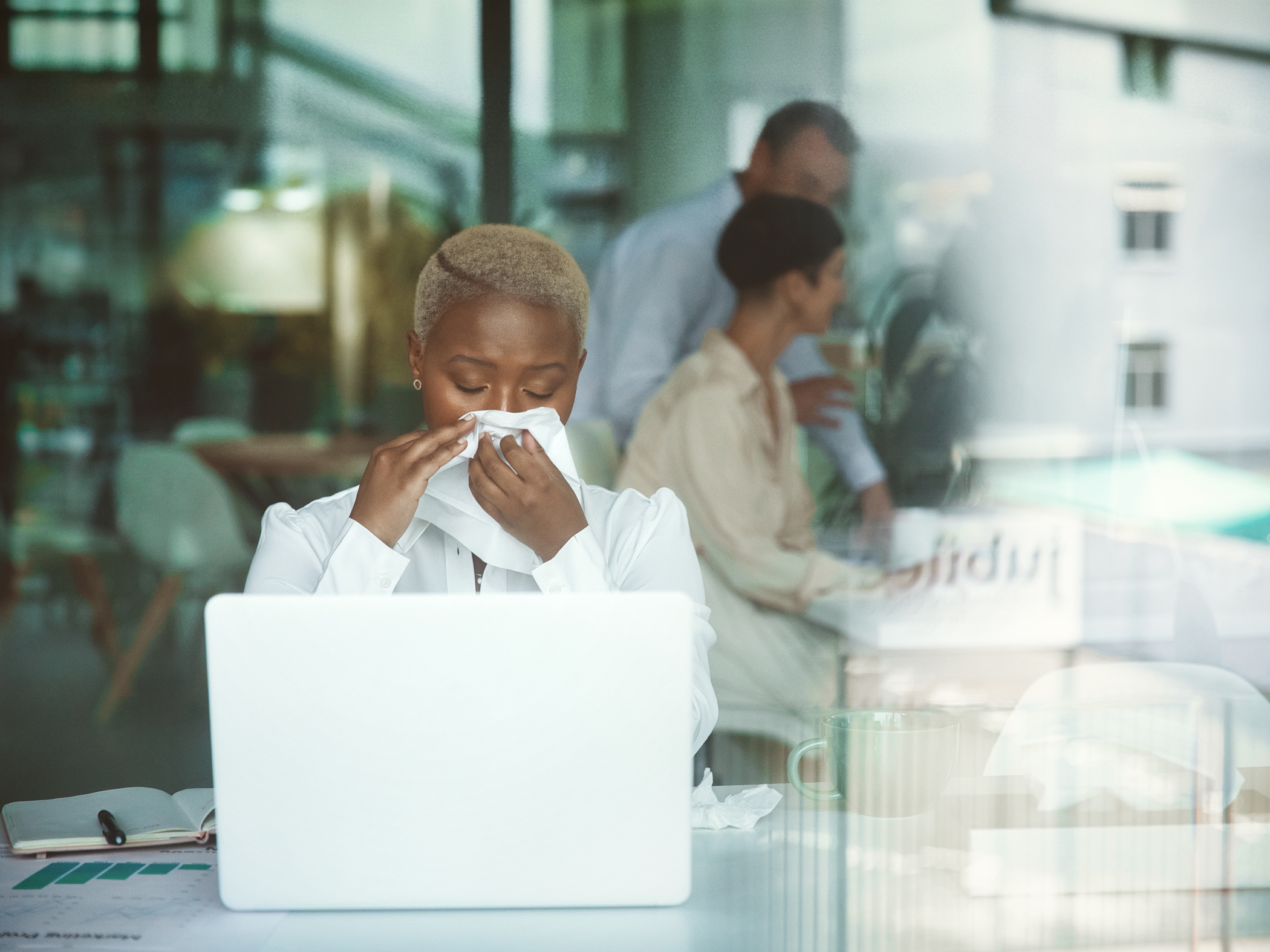 Office worker sneezing