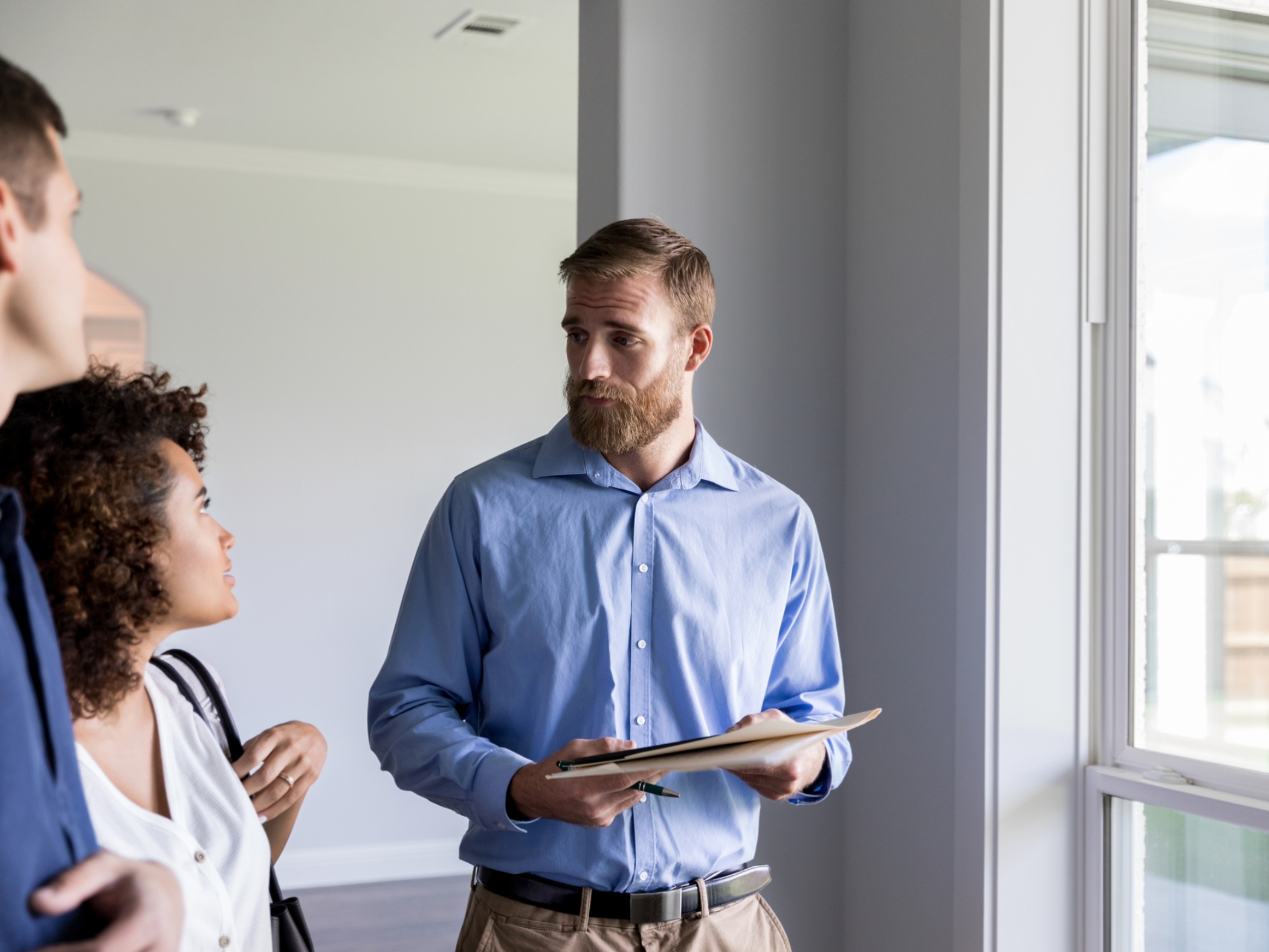 Homeowners talking to a contractor