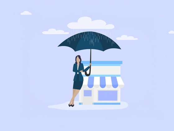 Businesswoman holding umbrella