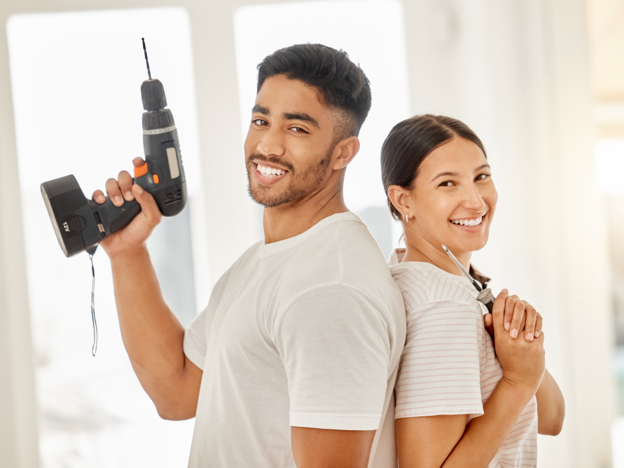 Couple holding tools