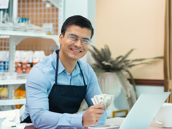 Business owner holding money