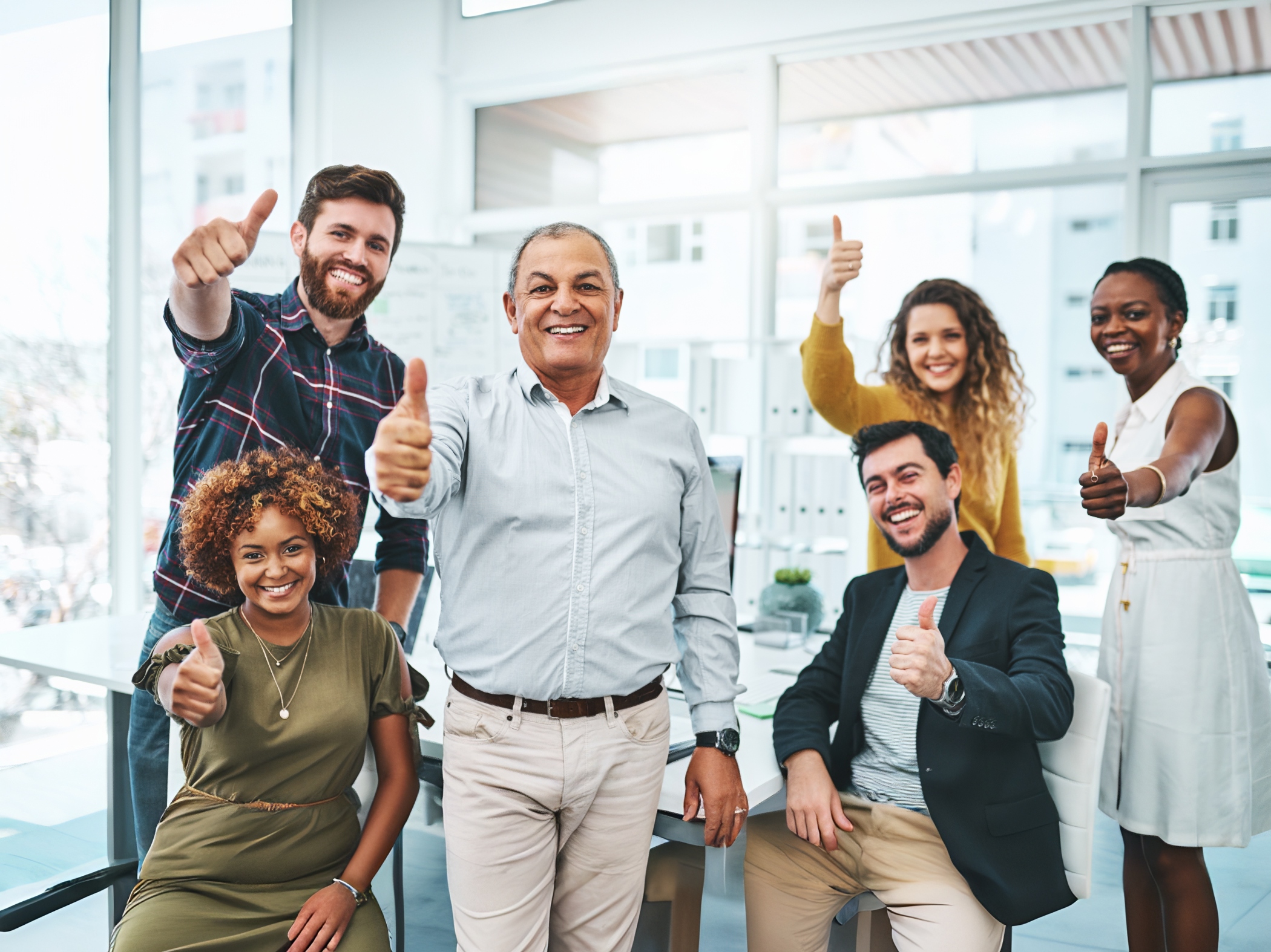 Business people thumbs up