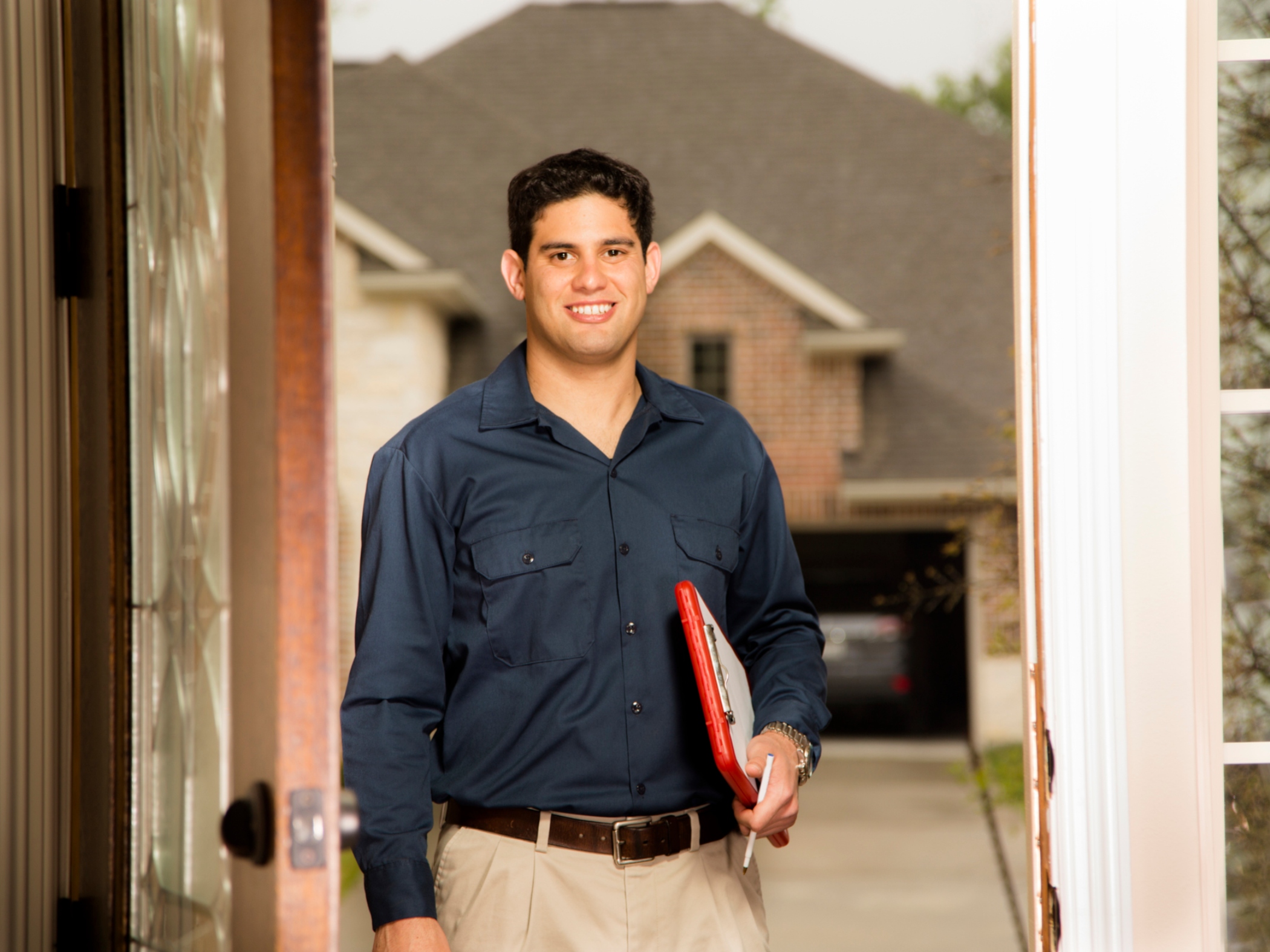 Home energy auditor in doorway