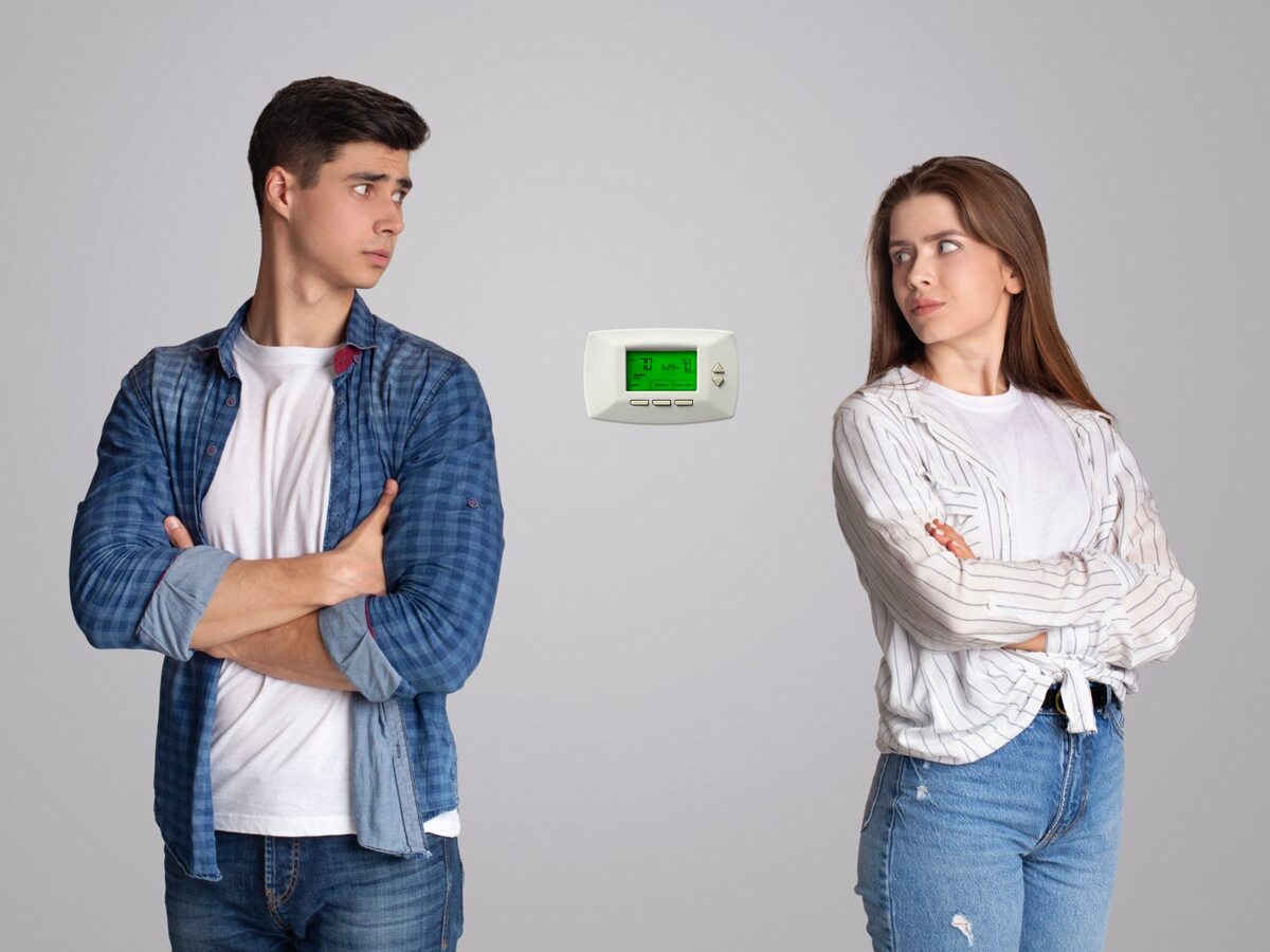 Couple fighting over thermostat